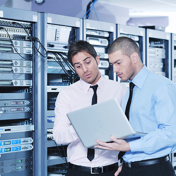 Diverse team of professionals collaborating around a large digital display